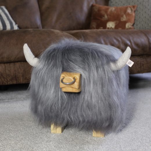 Highland Bull Footstool in Stone with a Nose Ring Highland bull footstool in stone with a nose ring